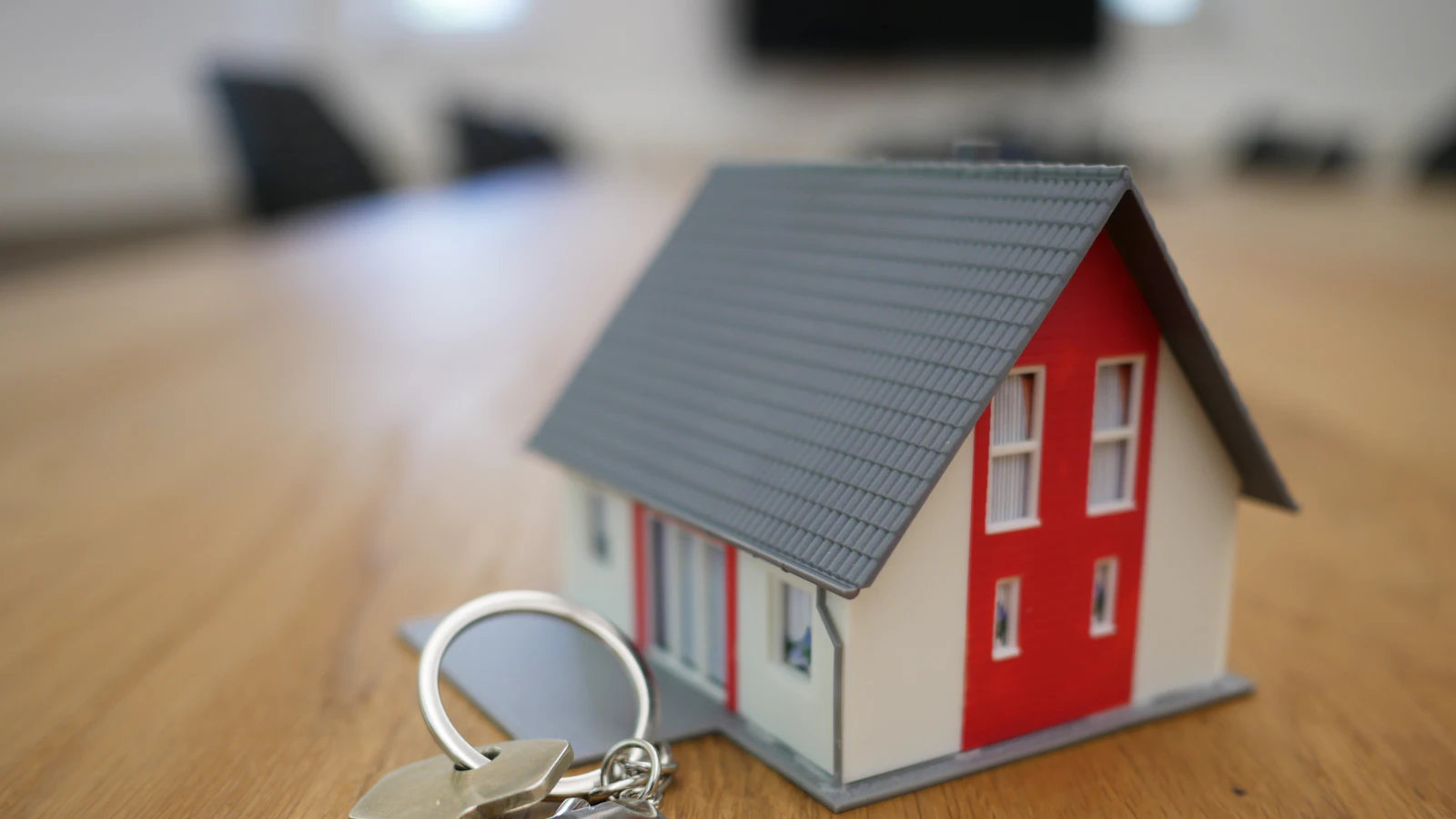 Model house with keys on a table